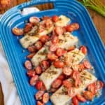 Blue platter with Sea Bass and Tomatoes in a Lemon-Butter Sauce