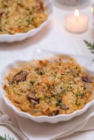 Shell shaped dish holding an individual serving of Shrimp and Crab Gratin