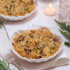 Shell shaped dish holding an individual serving of Shrimp and Crab Gratin