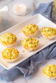 rectangular white platter filled with 5 Shrimp Curry Bites; dip in a bowl in the background