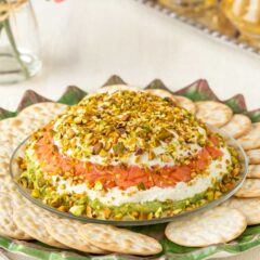 Smoked Salmon Cream Cheese Spread with Avocado on a serving platter surrounded by crackers