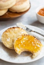 Sliced toasted english muffin with orange marmalade