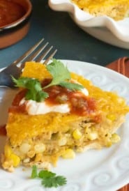 white plate with a slice of Crustless Southwestern Chicken Pie