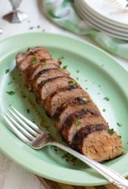 spicy rubbed pork tenderloin, sliced and served on a platter