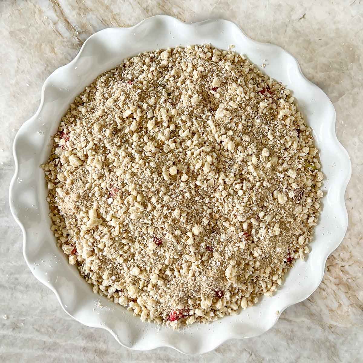 topping sprinkled on top of crisp filling in pie plate