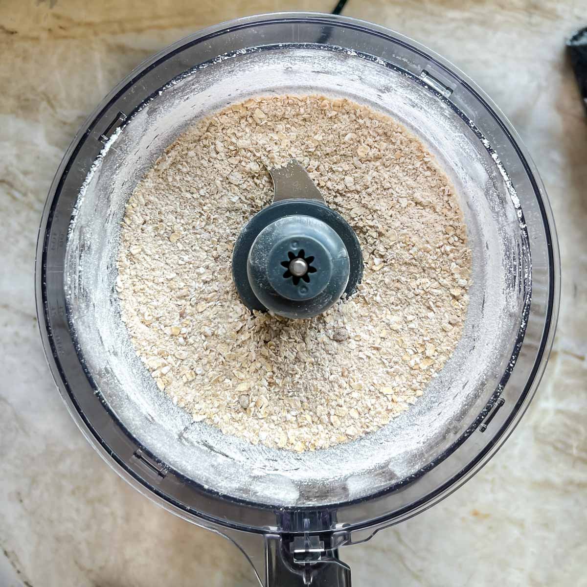 Food processor filled with the mixed topping dry ingredients
