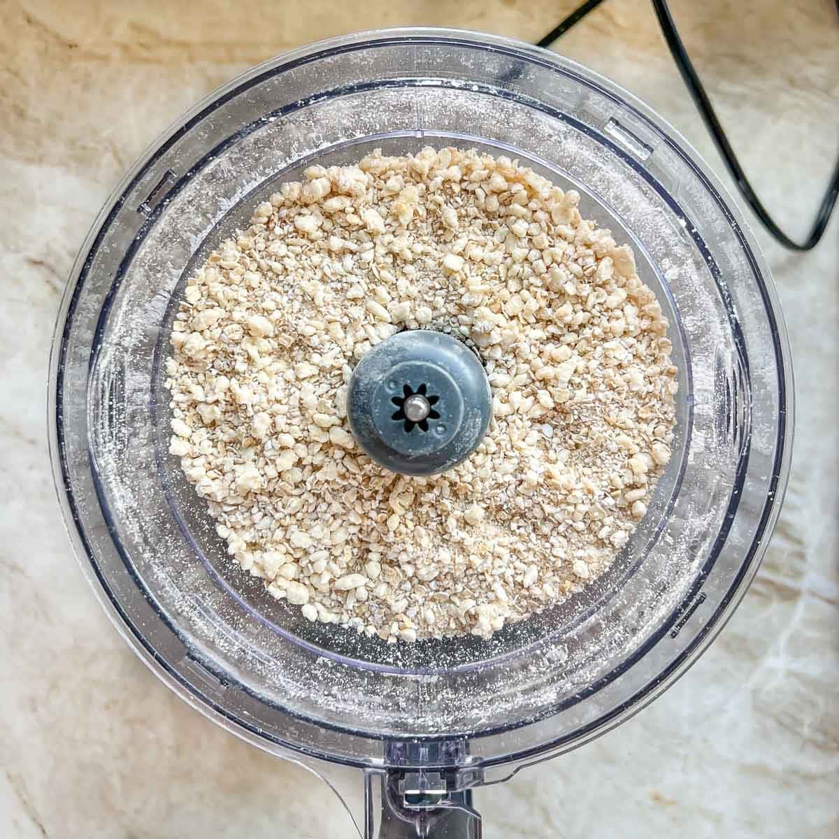 Food processor showing how the fruit crisp topping should look after incorporating the butter