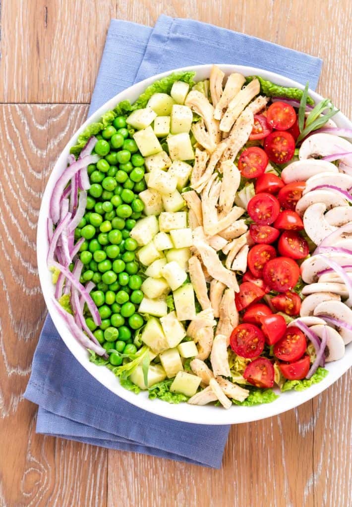 bowl holding rows of the ingredients in Tarragon Chicken Salad