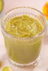 clear glass filled with Tomatillo Avocado Sauce