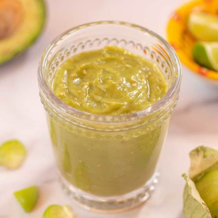 clear glass filled with Tomatillo Avocado Sauce