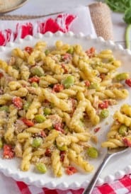 whilte plate showing a portion of Tuna and Roasted Red Pepper Pasta Salad