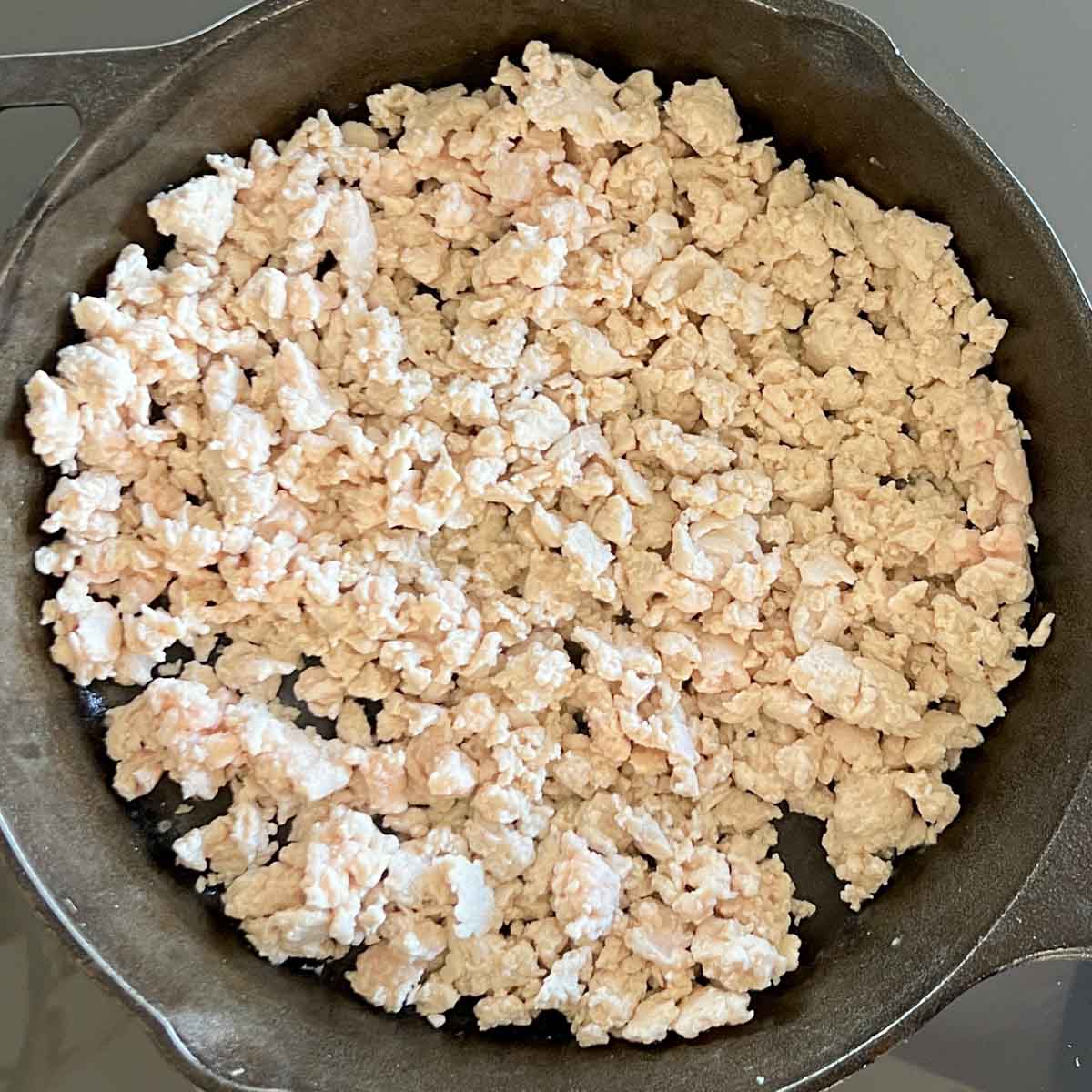 Ground turkey cooking in skillet