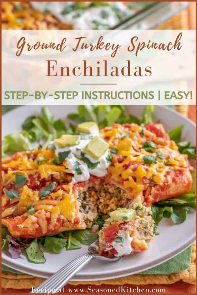 two ground turkey enchiladas with a fork taking out a bite