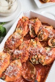 overhead of casserole dish filled with shells stuffed with ground turkey and vegetables