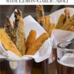 Siver cups filled with Veggie Fries in a napkin, with Lemon-Garlic Aioli on the side