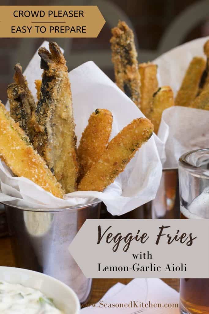 silver cups lined with white paper napkins, and filled with Veggie Fries. Lemon Garlic Aioli is on the side