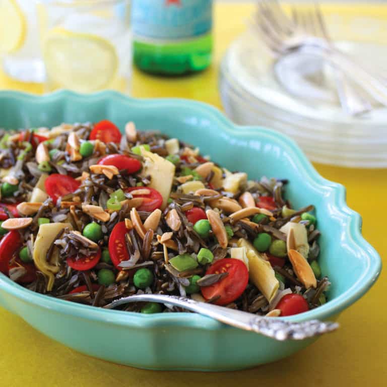 Oval blue bowl filled with Elegant Wild Rice Salad with Parmesan Vinaigrette